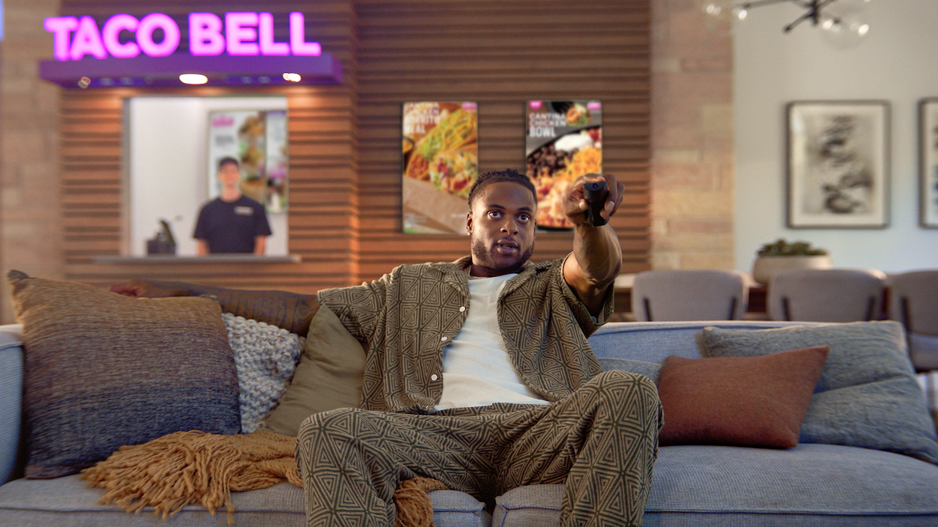 Davante watching TV with his Taco Bell in the background